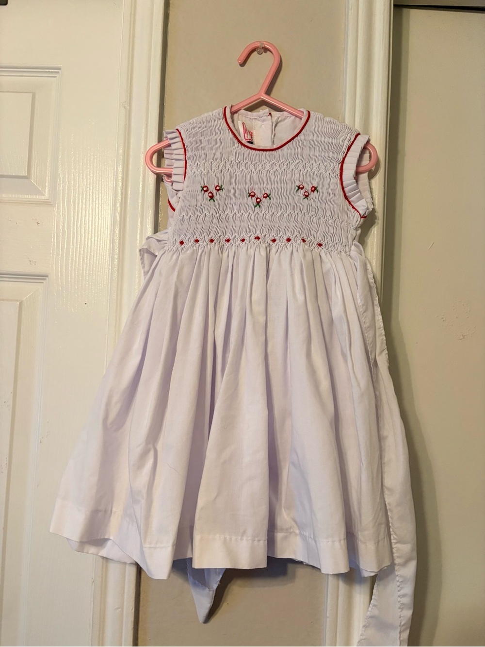 Lollipop Children Boutique White Girls Smocked Dress with Red Flowers.